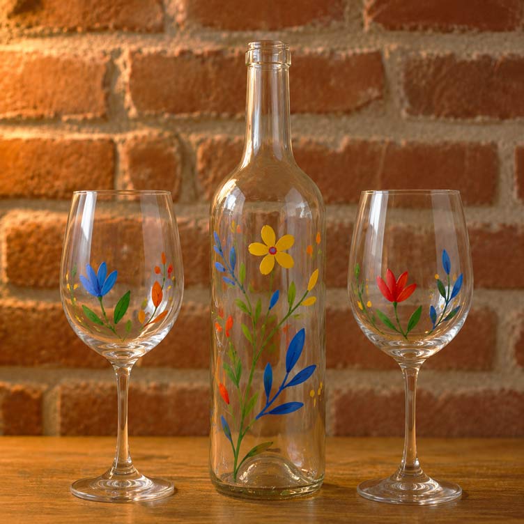 Hand-decorated glass cups and vases in a group workshop at Imagina Art, Girona
